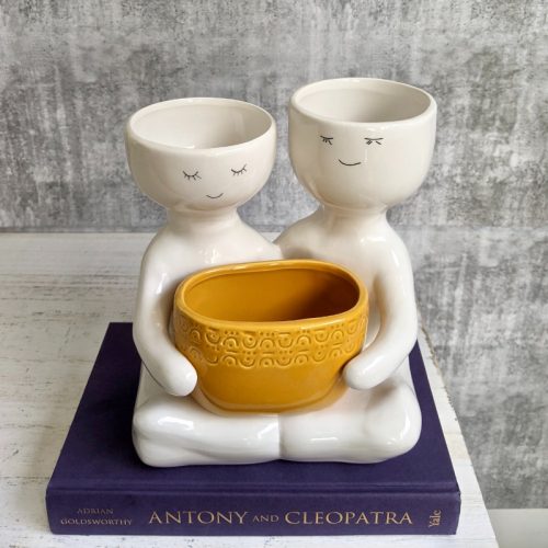 Sitting People Duo Holding A Pot Planter