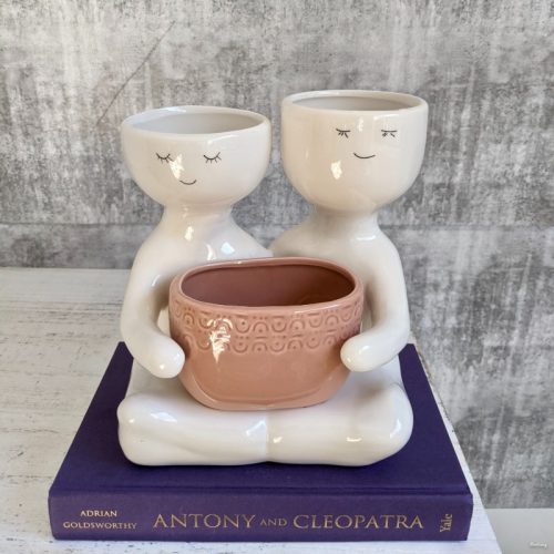 Sitting Coral Duo Person Holding A Pot Planter