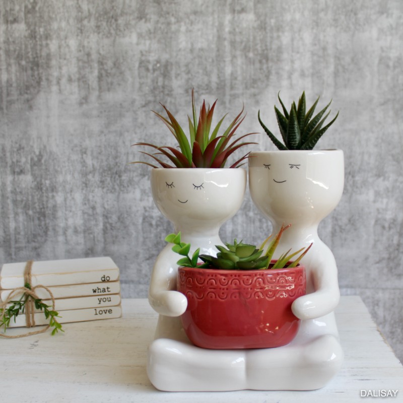 Sitting Berry People Duo Holding A Pot Planter