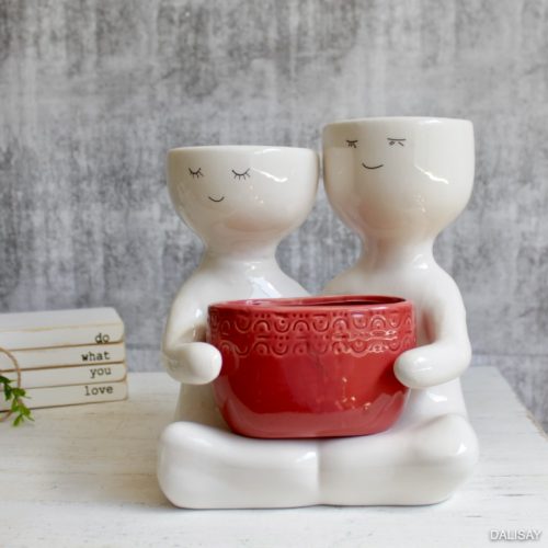 Sitting Berry People Duo Holding A Pot Planter