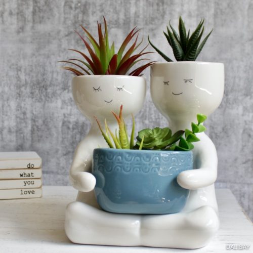 Sitting Blue People Duo Holding A Pot Planter