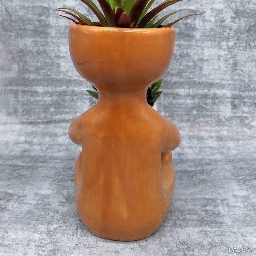 Caramel Sitting Person Holding A Pot Planter