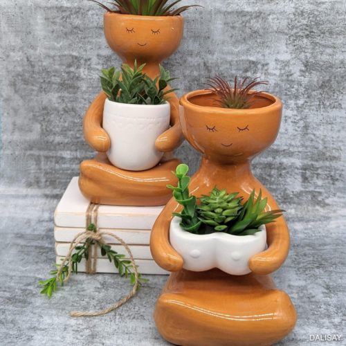 Caramel Sitting Person Holding A Pot Planter