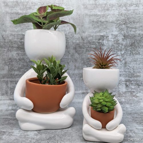 Sitting Person Holding a Pot Planter