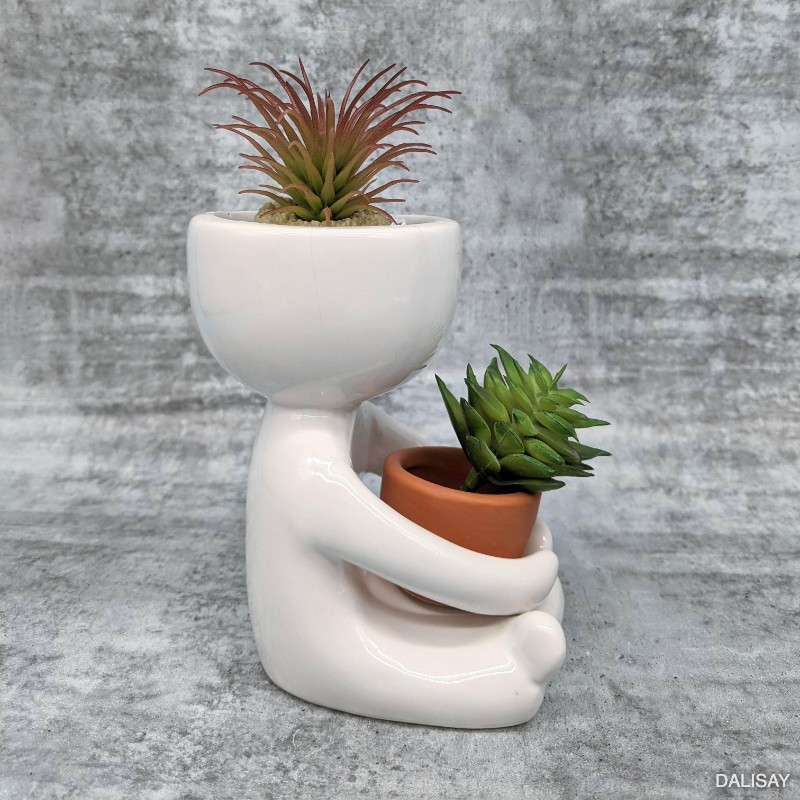 Sitting Small Person Holding a Pot Planter