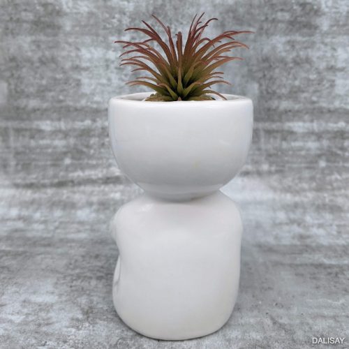 Sitting Small Person Holding a Pot Planter