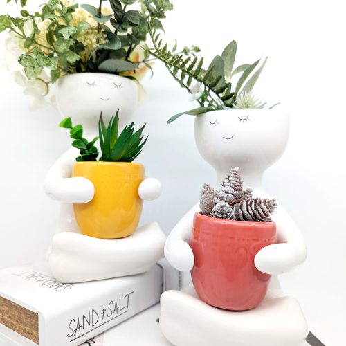 Sitting People Holding A Pot Planter