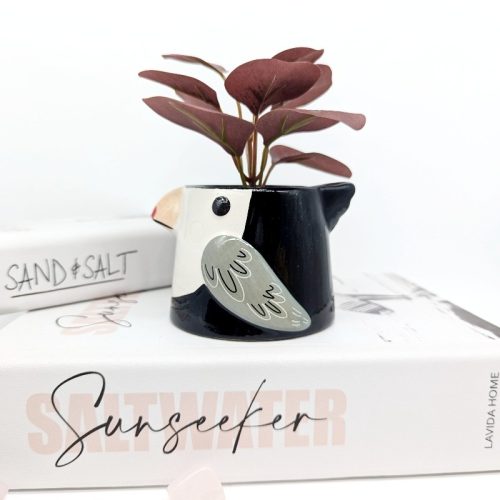 Exhibit your love for greenery in your home or garden with this contemporary style Black Bird Ceramic Planter Pot. Product Features: Features a ceramic planter in shape of a bird Planter has a smooth texture Display some flowers, succulents, herbs, plants or cacti in this pot Product Specification: Material: Ceramic Size: Length - 10.2 centimetres, Width - 8.5 centimetres, Height - 6.8 centimetres Colors: Black (As Pictured) Features: Drainage hole and stopper Please note that this listing is for a single planter. Accessories and Plants shown are only for display purpose.