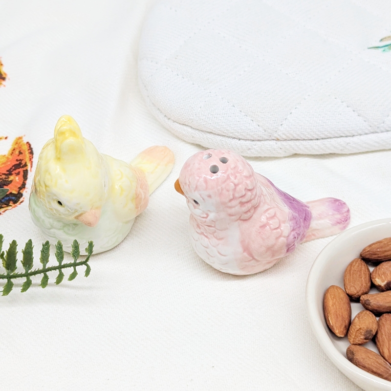 PXL_20251105_032103099 Purple Yellow Parrot Salt Pepper Shaker Set