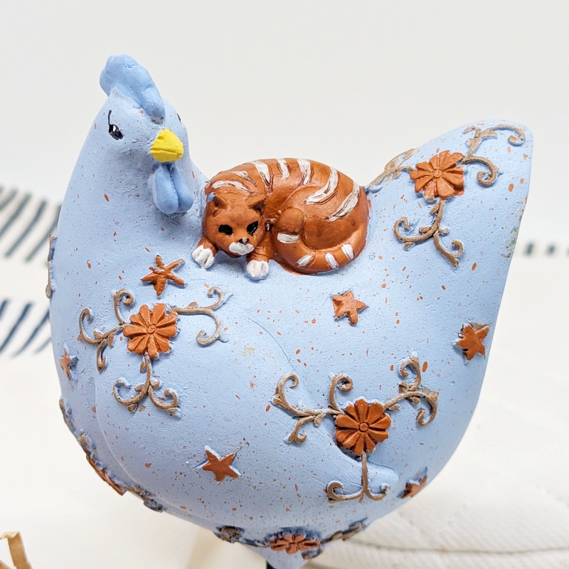 PXL_20251105_235720670 Purrfect Cat on Chicken Figurine