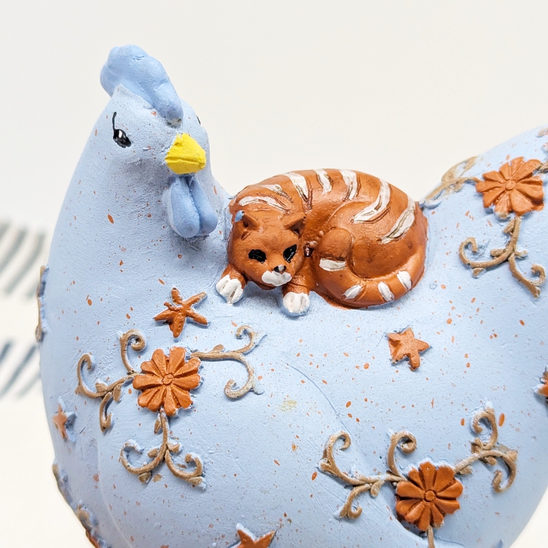 PXL_20251105_235724158 Purrfect Cat on Chicken Figurine