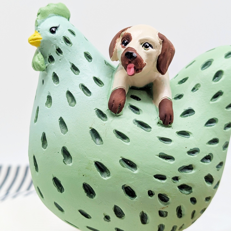 PXL_20251106_001307680 Hanging Dog Chicken Figurine