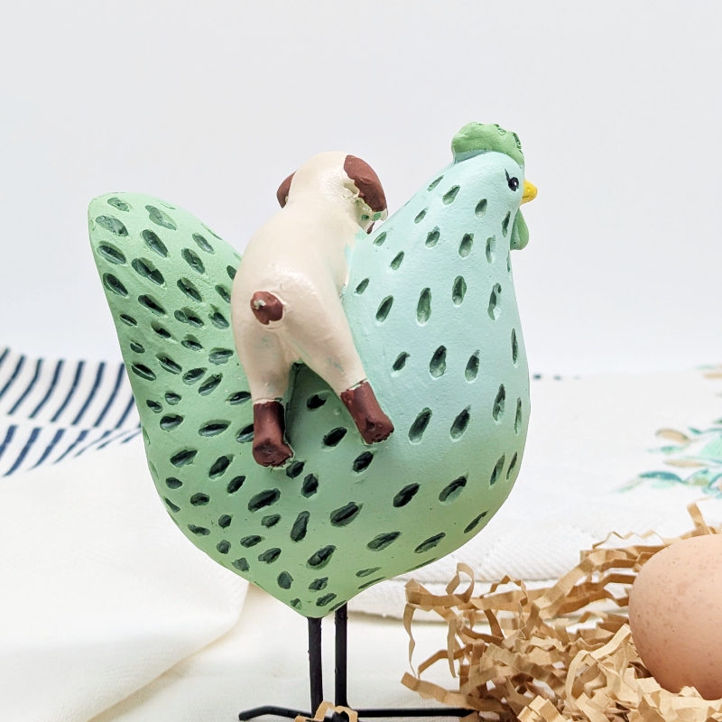 PXL_20251106_001334591 Hanging Dog Chicken Figurine