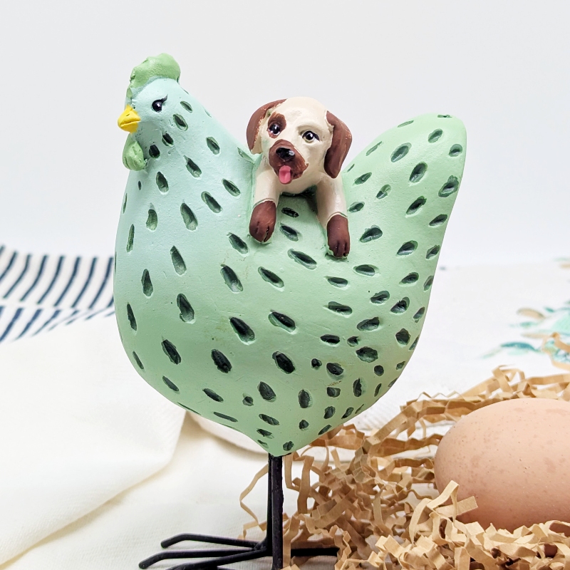 PXL_20251106_001356589 Hanging Dog Chicken Figurine