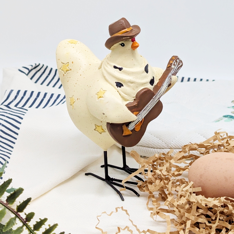 PXL_20251106_001726413 Musical Cowboy Chicken Figurine