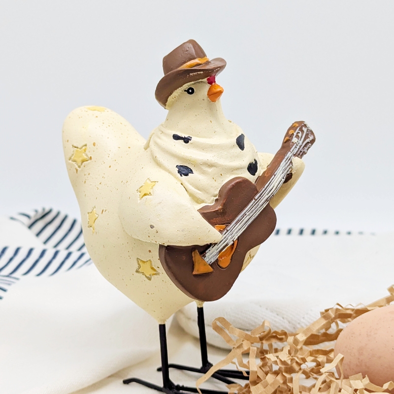 PXL_20251106_001730833 Musical Cowboy Chicken Figurine
