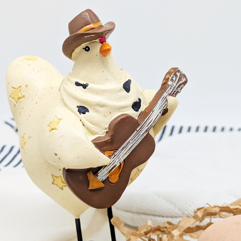 PXL_20251106_001735990 Musical Cowboy Chicken Figurine
