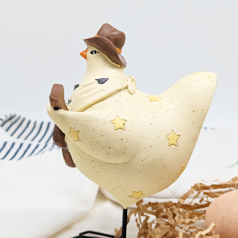 PXL_20251106_001756685 Musical Cowboy Chicken Figurine