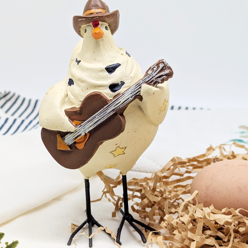 PXL_20251106_001804106 Musical Cowboy Chicken Figurine
